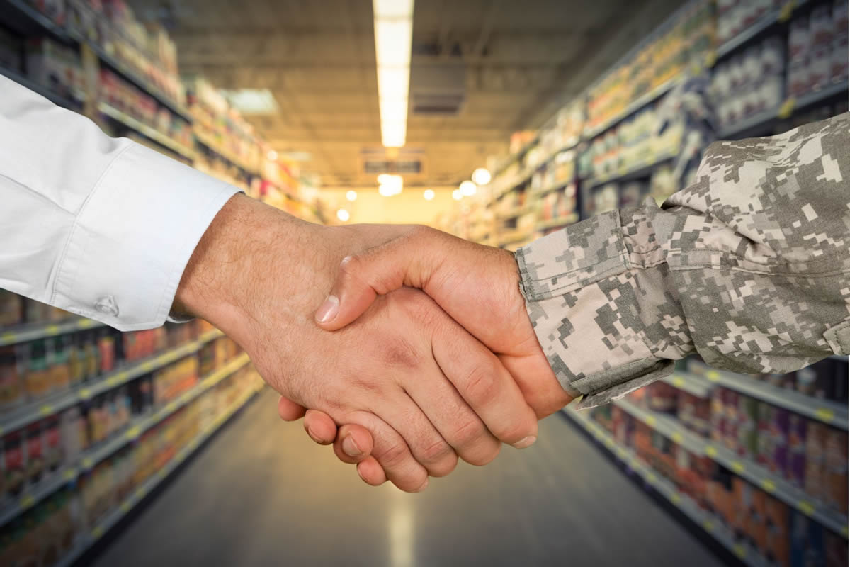 deca-military-market-commissary-handshake